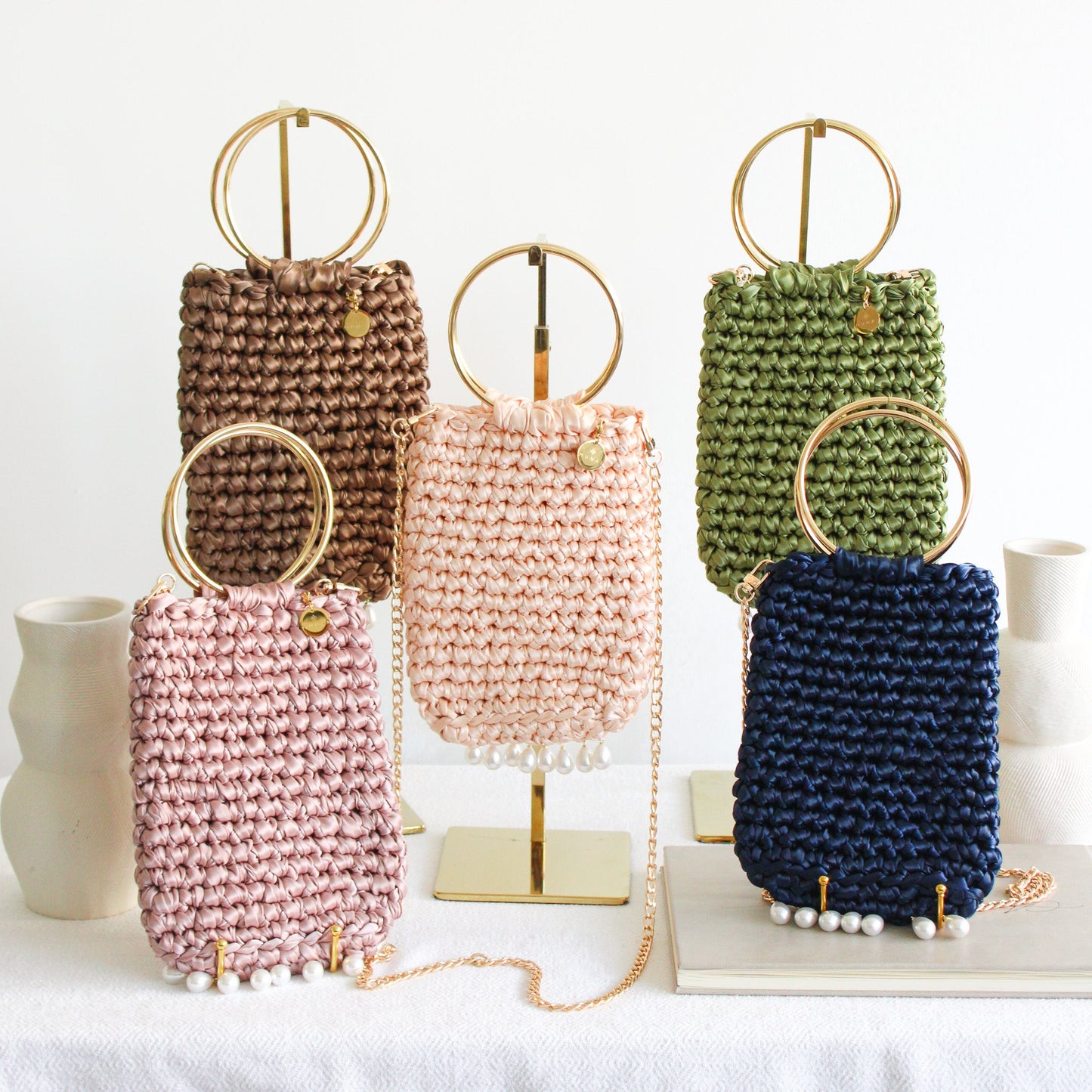 Molly crochet bag spring colors: green, brown, blue, light peach and dusty pink
