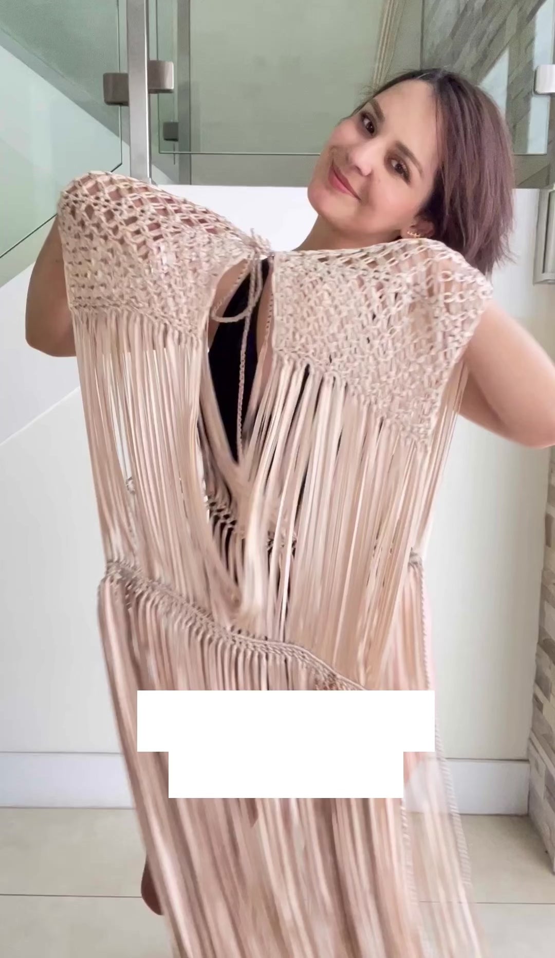 Beige macrame dress for festival or beach vacation. Wrap tie closure at shoulders and waist. Care instructions: Steam to straighten any wrinkles. Ethically made by Bolivian Artisans. 100% Rayon. Colors available: Beige, Black, Gold.