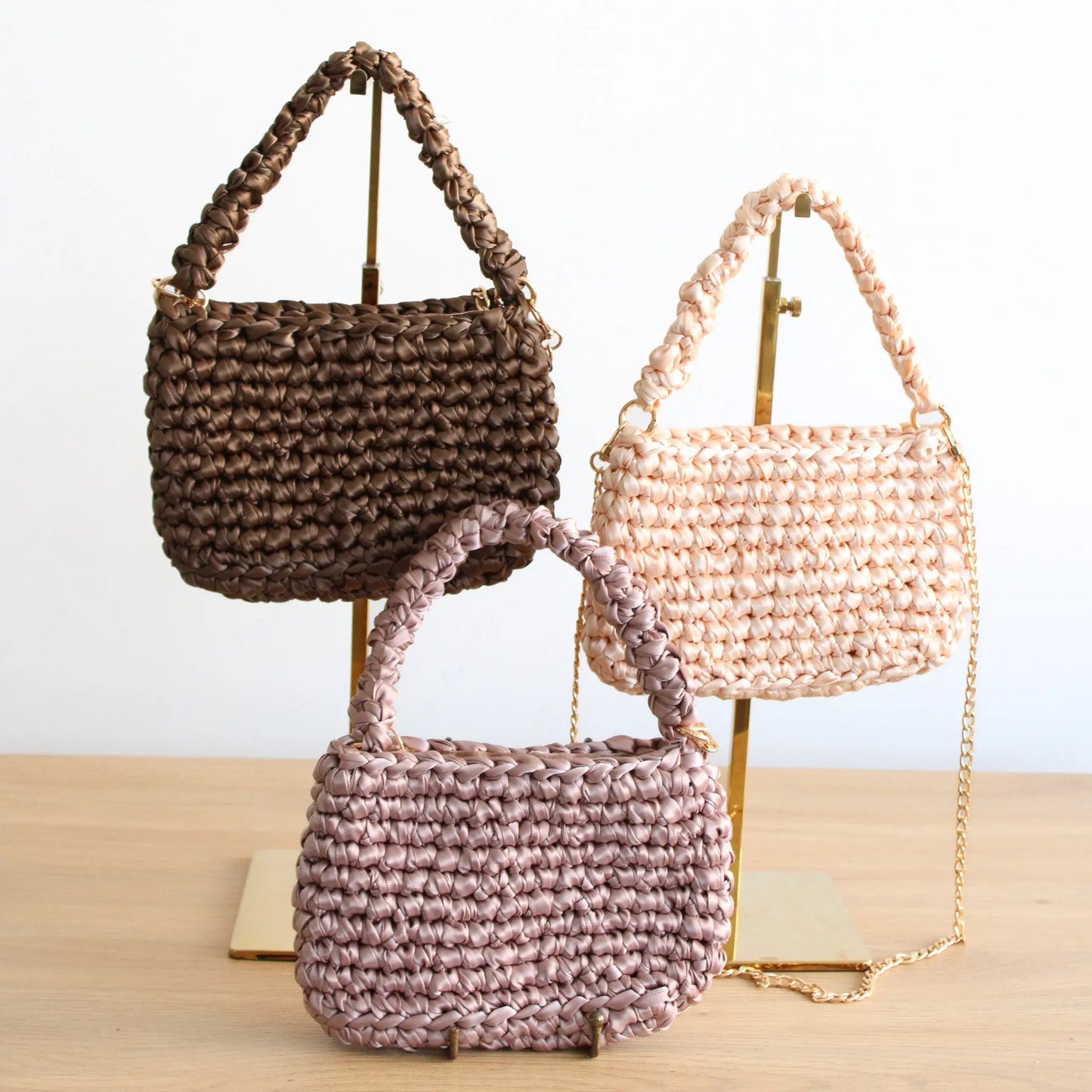 Handmade Stella crochet bag. Stylish crochet bah with top handle. Includes long gold chain strap for crossbody looks. Luxury bag fully lined.