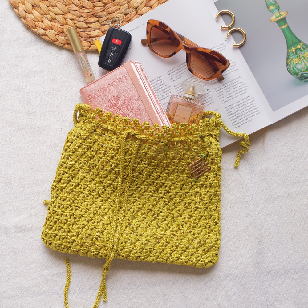 
                      
                        Handmade purse. Crochet strap, Fully lined, includes pockets. Drawstring crochet bag perfect for traveling. 
                      
                    
