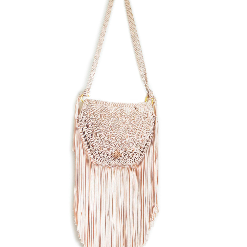 
                      
                        Beige Macrame crossbody bag with fringes. Includes lining and zipper. Handmade in Bolivia. Hand Wash and professional cleaning only. 100% Rayon
                      
                    