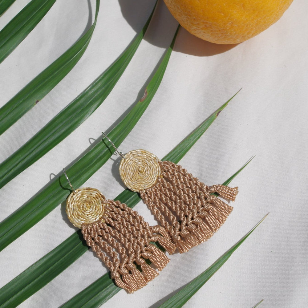
                      
                        Totora Earrings
                      
                    